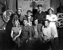 The cast from season 6, 1977 (clockwise from left): William Christopher, Gary Burghoff, David Ogden Stiers, Jamie Farr, Mike Farrell, Alan Alda, Harry Morgan, Loretta Swit