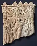 Plaque with female figure dressed in ancient variation of sari, 1st century BCE