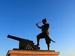 Monument of a soldiers holding a sword