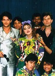 Group photo of a young Madonna in the center and smiling