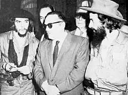 Che Guevara, Manuel Urrutia, and Camilo Cienfuegos standing together