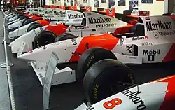Red-and-white Marlboro McLaren cars on display