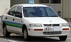 1995–1996 Mazda Familia saloon AWD (Japan) with North American market front bumper