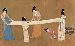 A painting depicting women inspecting silk, early 12th century, ink and color on silk.