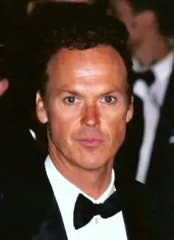 A formally-dressed Michael Keaton
