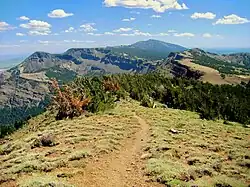 The summit trail and surrounding mountains.