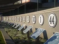 Row of blue numbers hung on a wall