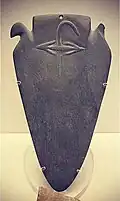 The Min Palette: a mudstone palette with the archaic hieroglyph Min for the god of fertility Min in relief. Pre-dynastic Naqada III. 3250–3100 BC. El-Amra