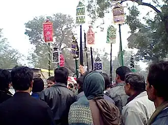 Ashura procession in India carrying alams, signifying the ensign of Husayn in Karbala