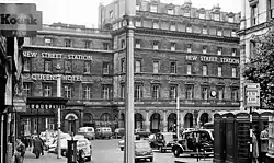 The main entrance to the old station on Stephenson Street, including Queens Hotel in 1962