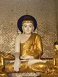 Burmese style Buddha, Shwedagon pagoda, Yangon.