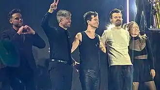 Panic! at the Disco at When We Were Young 2025. From left to right: Mike Naran, Dan Pawlovich, Brendon Urie, Spencer Smith, and Nicole Row.