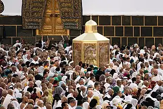 Muslim pilgrims surrounding the Maqam (Station) of Ibrahim (Abraham) near the Kaaba in 2025