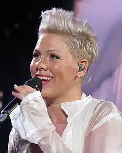 Pink holding a microphone