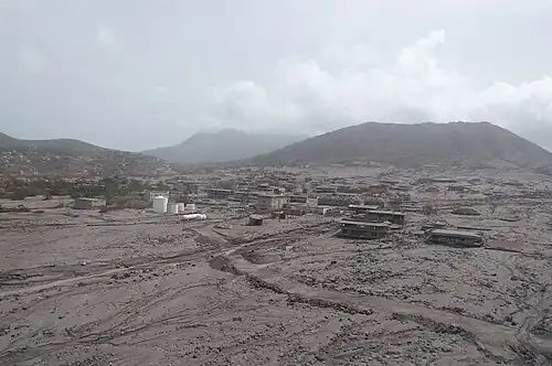 Aerial view of Plymouth, Montserrat, buried under grey volcanic ash