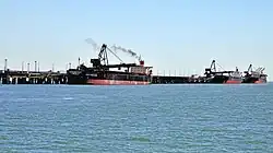 Cargo ships at the Port of Gladstone, Queensland's largest commodity seaport