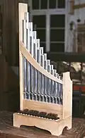 cf. Portative organ (portable pipe organ with bellows)