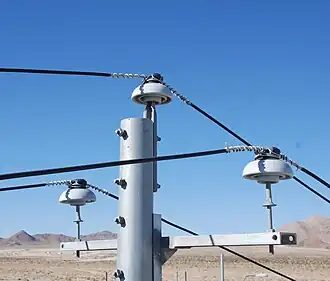 Power lines supported by ceramic pin-type insulators in California