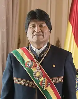 Morales by a Bolivian flag