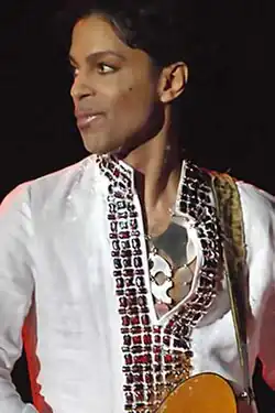 A man looking to the left while performing