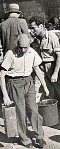 Mathematics professor Michael Fekete, the Provost of the Hebrew University of Jerusalem, with his water quota during the siege of Jerusalem