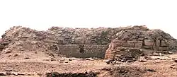 Low ruins in the desert, looking like a wall