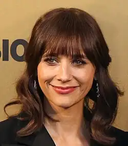 Jones looking towards a camera and smiling
