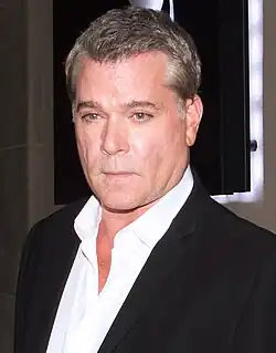 A 59-year-old man looking at the camera
