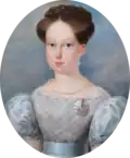 Painting showing the head and shoulders of a young woman wearing a lacey blue dress with auburn hair pulled back