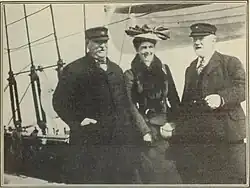 Grover Cleveland, Frances Cleveland, and Elisa Benedict stand on the deck of a boat