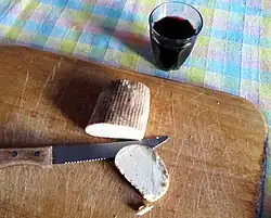 A piece of soft curd cheese, oven-baked to increase shelf life