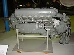 A left side view of a gloss grey -painted aircraft piston engine on static display