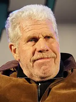 Perlman looking towards a camera