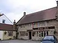 Stone building with sign saying The Royal Oak
