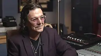 A man sitting in a recording studio