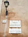Plaque on an external wall of the building indicating its extraterritorial status.