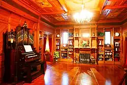 Organ, fireplace, and windows with Shakespeare quotations
