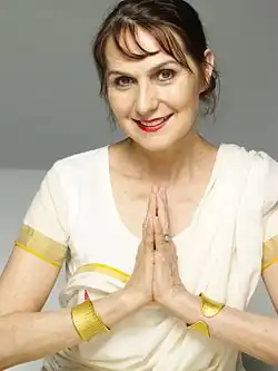 The modern yoga guru Sharon Gannon, co-founder of Jivamukti Yoga, making the Añjali Mudrā