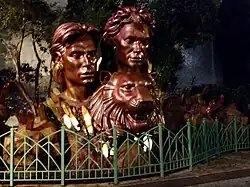 A large golden bust of Siegfried & Roy with a tiger