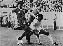 Graeme Souness, Phil Neal and Laurie Cunningham trying to take control of the ball