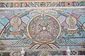 Soyombo and several Buddhist, Tengrist, and Chinese zodiac symbols in a wall mosaic.