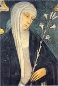 St. Catherine of Siena, wearing a white veil and black mantle, holds a stalk of lilies.