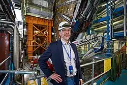 Stephane Willocq in front of the ATLAS experiment.