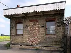 Small disused railway station looking from the other side of the track
