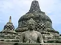 Buddha in the exposed stupa of Borobudur mandala, Central Java, Indonesia, c. 825.