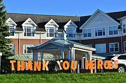 "Thank You Heroes" sign in orange