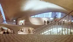A crowd inside the terminal, as seen from the building's upper level
