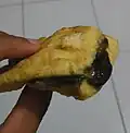 Tahu petis, fried tofu filled with petis (black colored shrimp paste sauce). Originated from Semarang, Central Java.