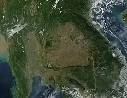 A view of Southeast Asia (Myanmar, Thailand, Laos, Cambodia, Vietnam, and southern China) from space, showing a large, central brown patch in the area of Thailand.