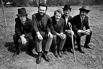 The Band sitting on a bench